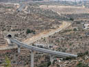 Annexation Fence crosses under the Israeli only road between settlements and Jerusalem