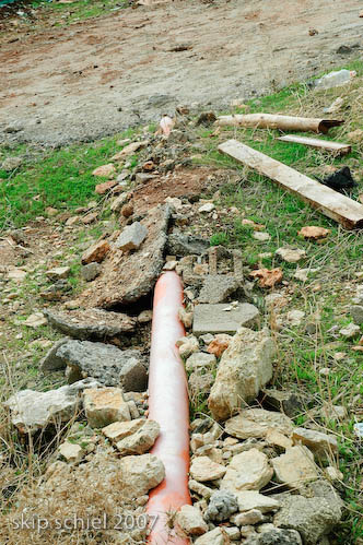 Black water led to a septic tank, which drains into the aquifer and cistern, polluting both